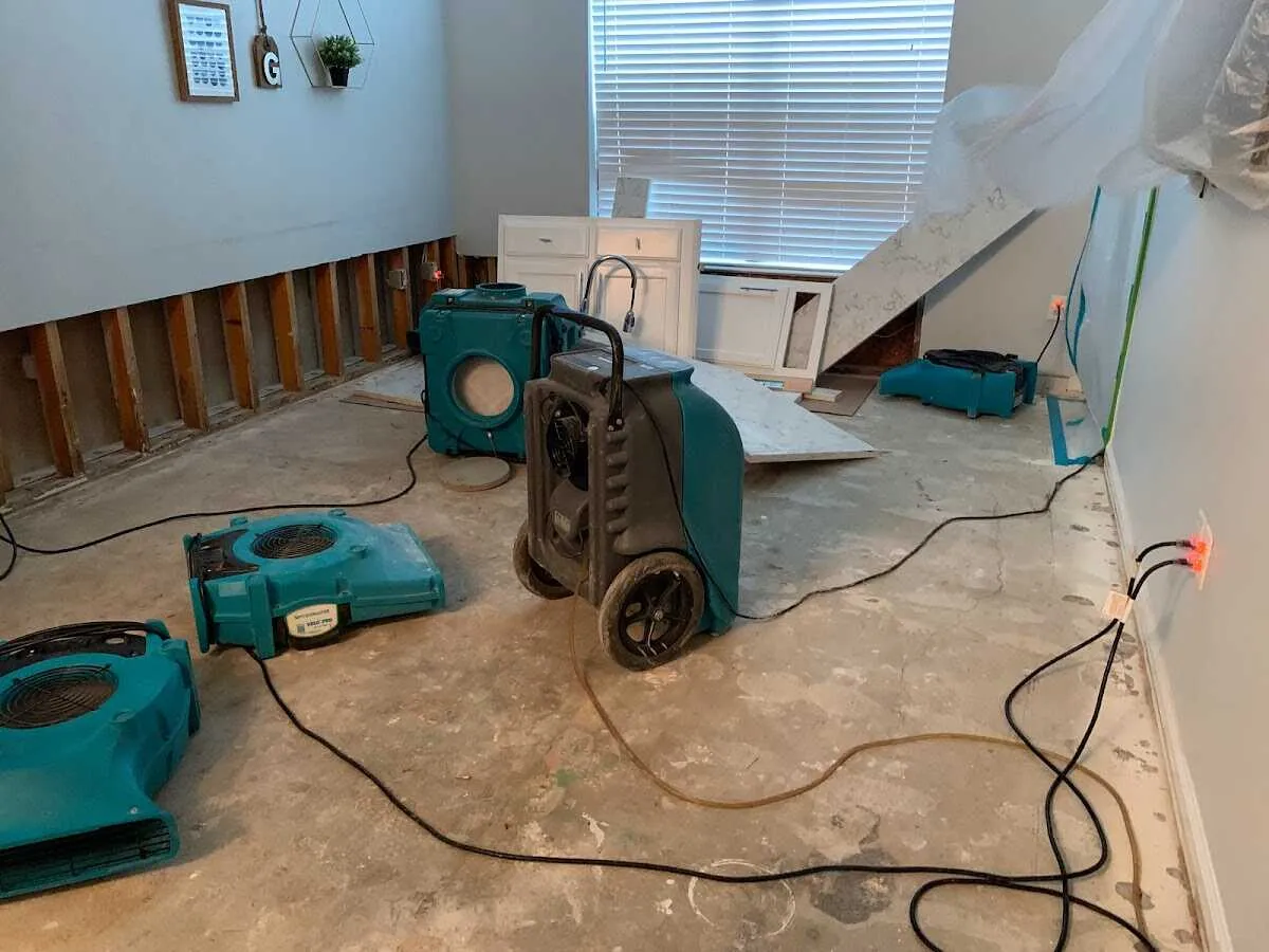 Dehumidifier in flood-cut room for Water Damage Restoration in Cherry Hills Village